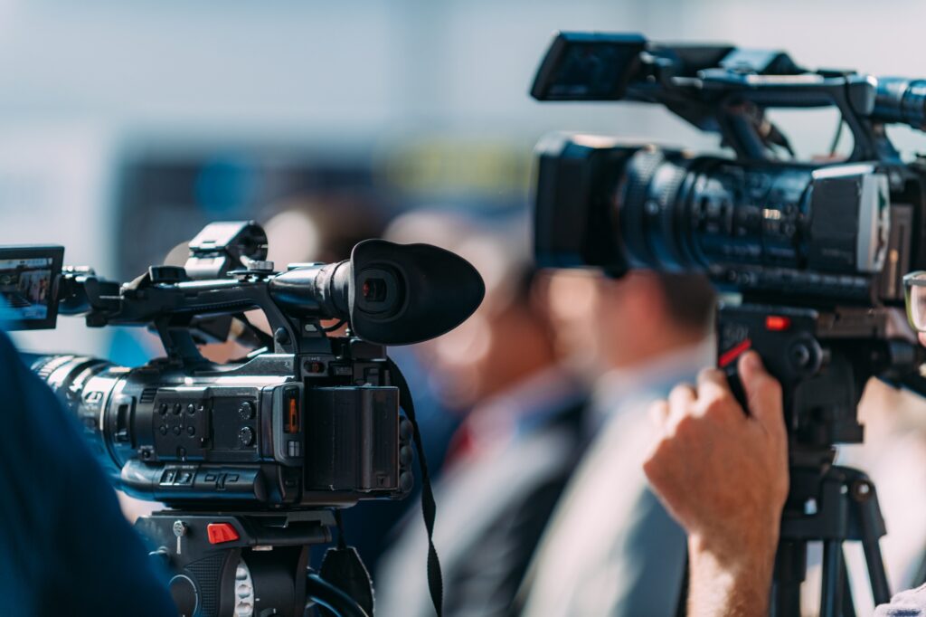 Cameraman Recording Event At Media Press Conference